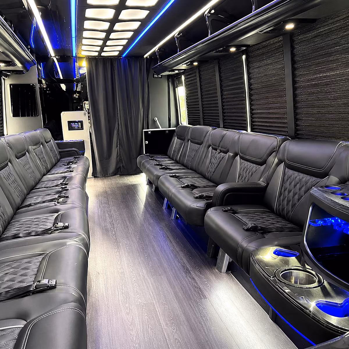 Friends laughing during a party bus celebration in Bakersfield